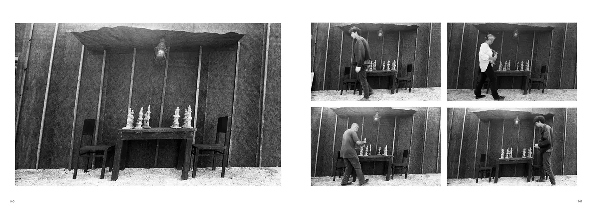 Inside the house, a table set with small white figures, facing four photographs of a visitor at it