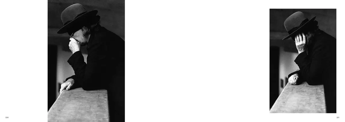 Byars leaning on a parapet, hand to his face, in two photographs that face each other across the spread