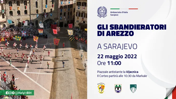 Flag throwers in a medieval square beside GLI SBANDIERATORI DI AREZZO A SARAJEVO, 22 May 2022