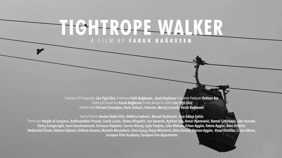Tightrope Walker: a cable car hangs from its wires against a grey sky, a bird in flight below the title